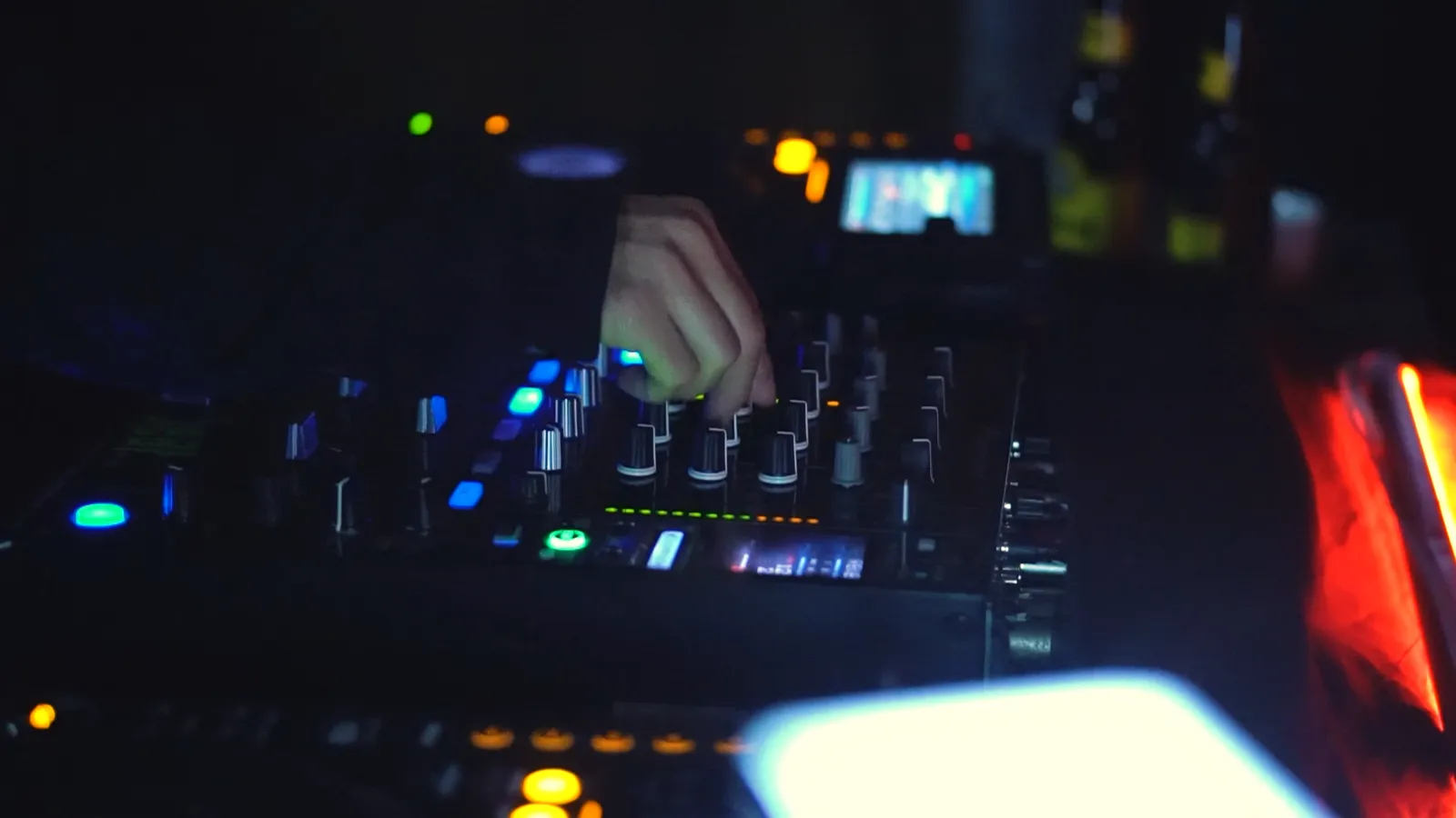 Aftermovie of the third Vortex edition — a hand rides the mixer faders under club lights.