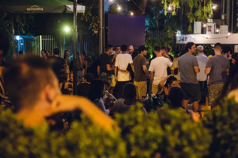 Night crowd at a Vortex edition, gathered under string lights in an open-air venue.